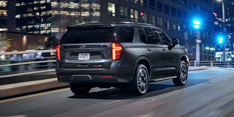 2021 Chevrolet Tahoe driving into the night
