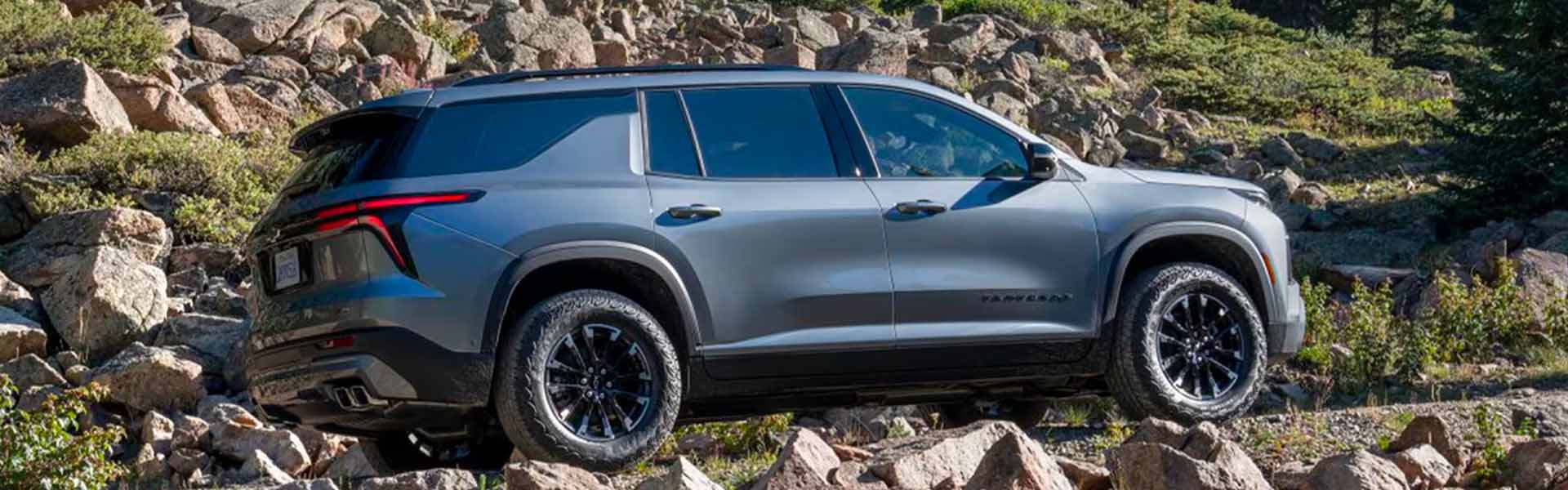 2025 Chevrolet Traverse driving over rocks