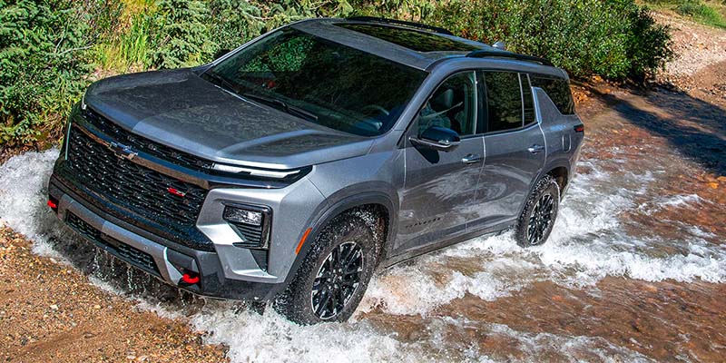 2025 Chevrolet Traverse driving over a creek