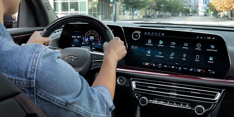 2025 Chevrolet Traverse woman driving showing digital display