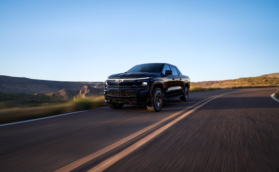 2026 Chevy Silverado EV driving on the road