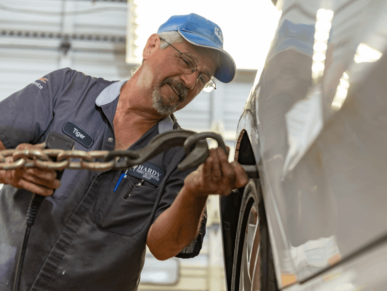 man fixing a car