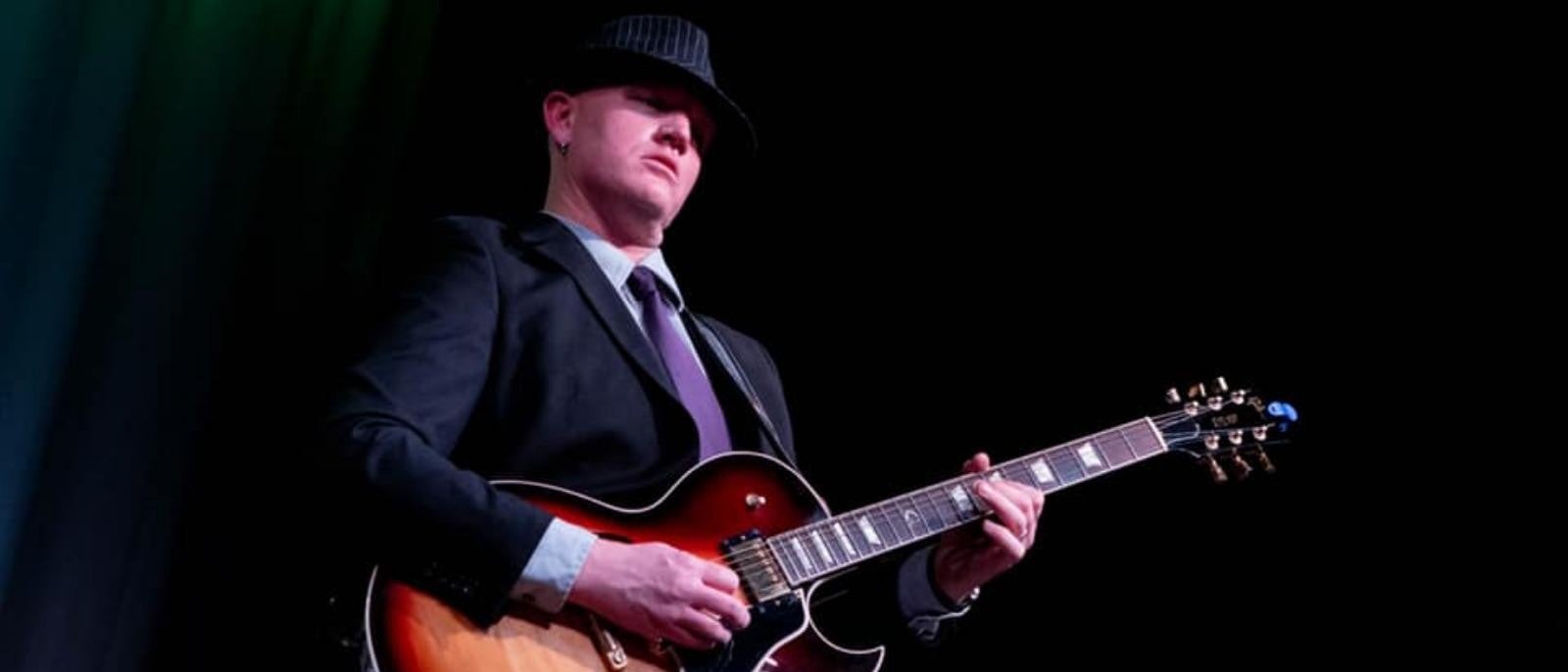 logan family play on guitar