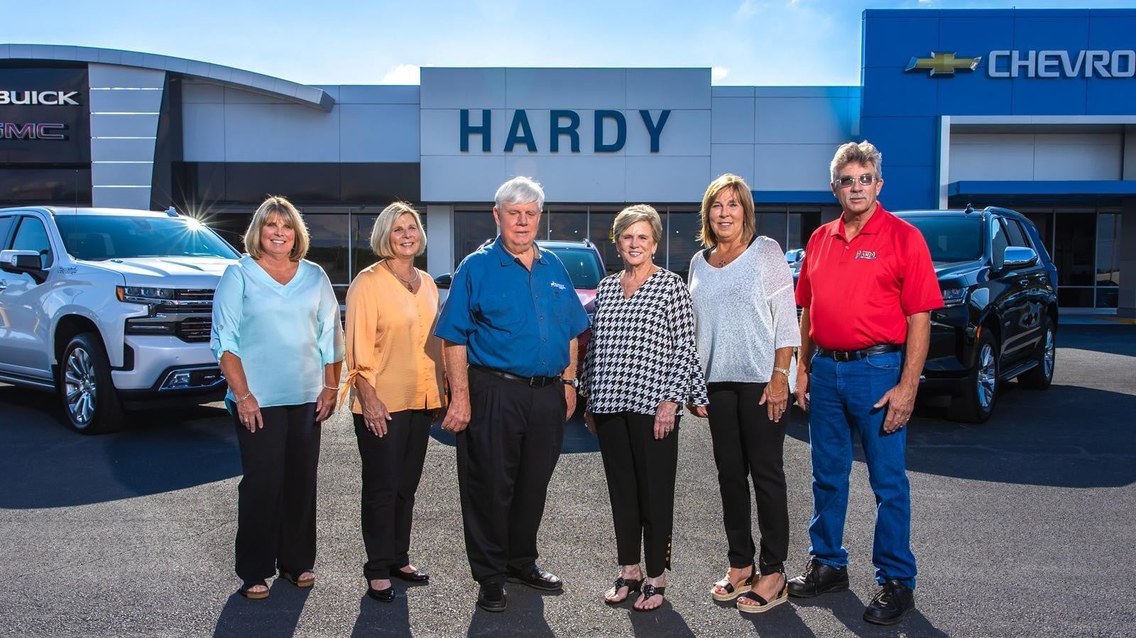 Team of Handy standing front of Handy Showroom