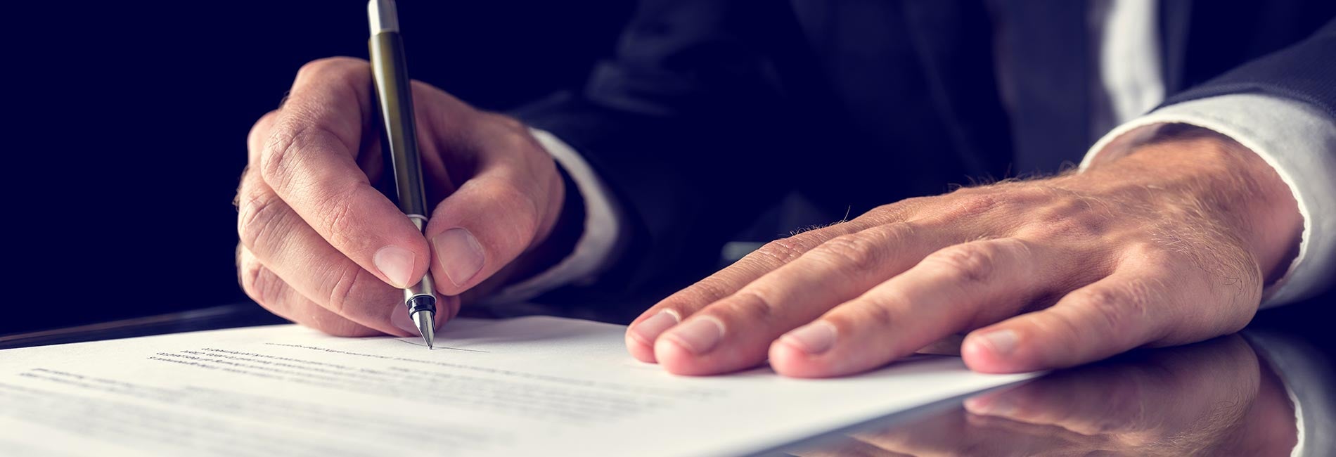 Customer signing a contract with a pen